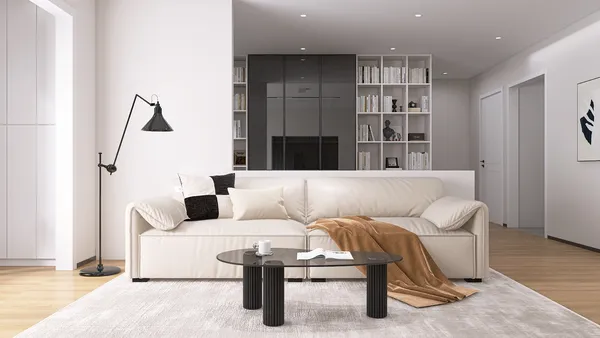 Modern living room featuring a cozy sofa with a throw blanket, showcasing a minimalistic design style that emphasizes spaciousness and warmth. This interior design integrates Homestyler's real-time 3D rendering feature for an immersive visual preview.